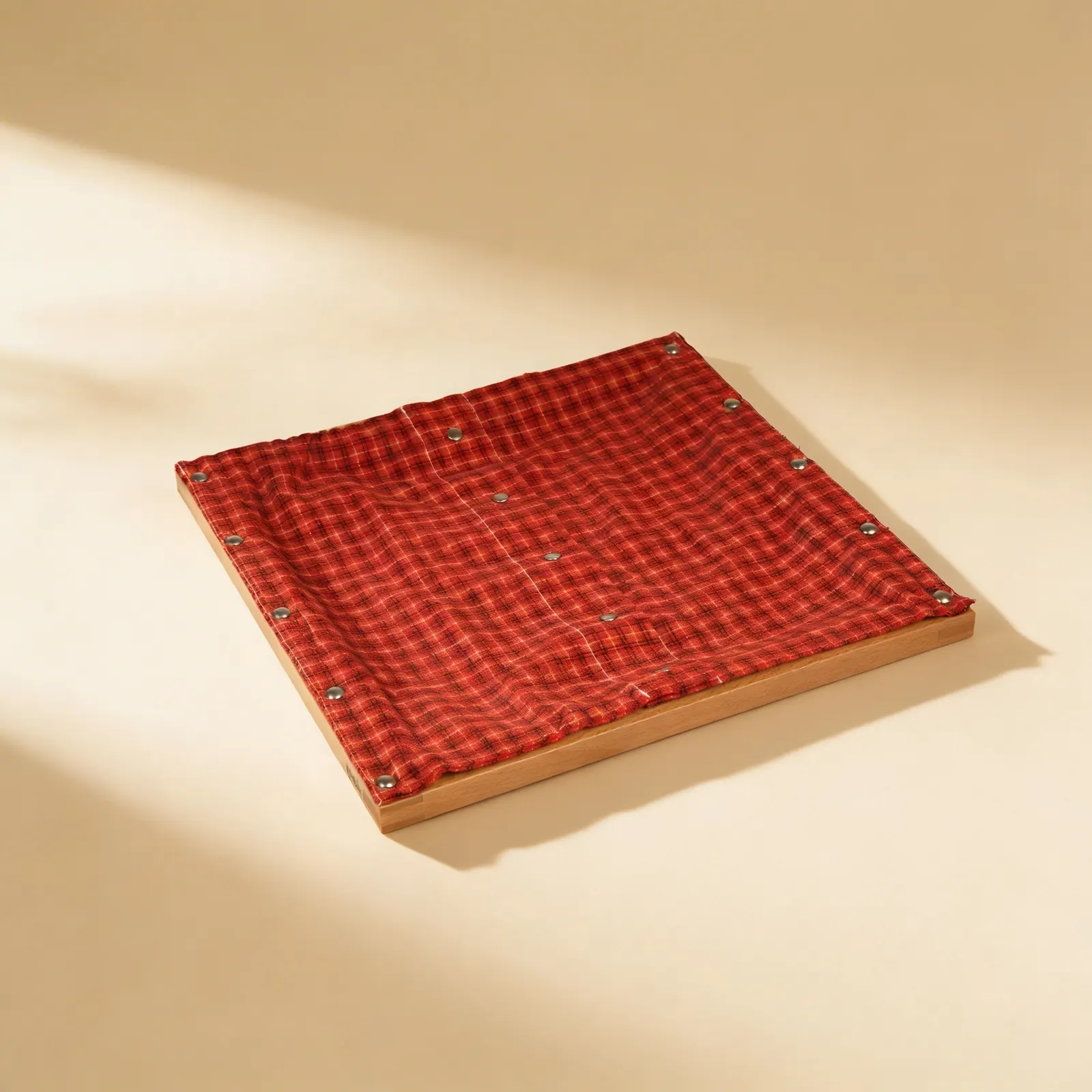 Dressing Frame: Snaps: Metal Snap Fasteners on Red & Black Plaid: Side view
