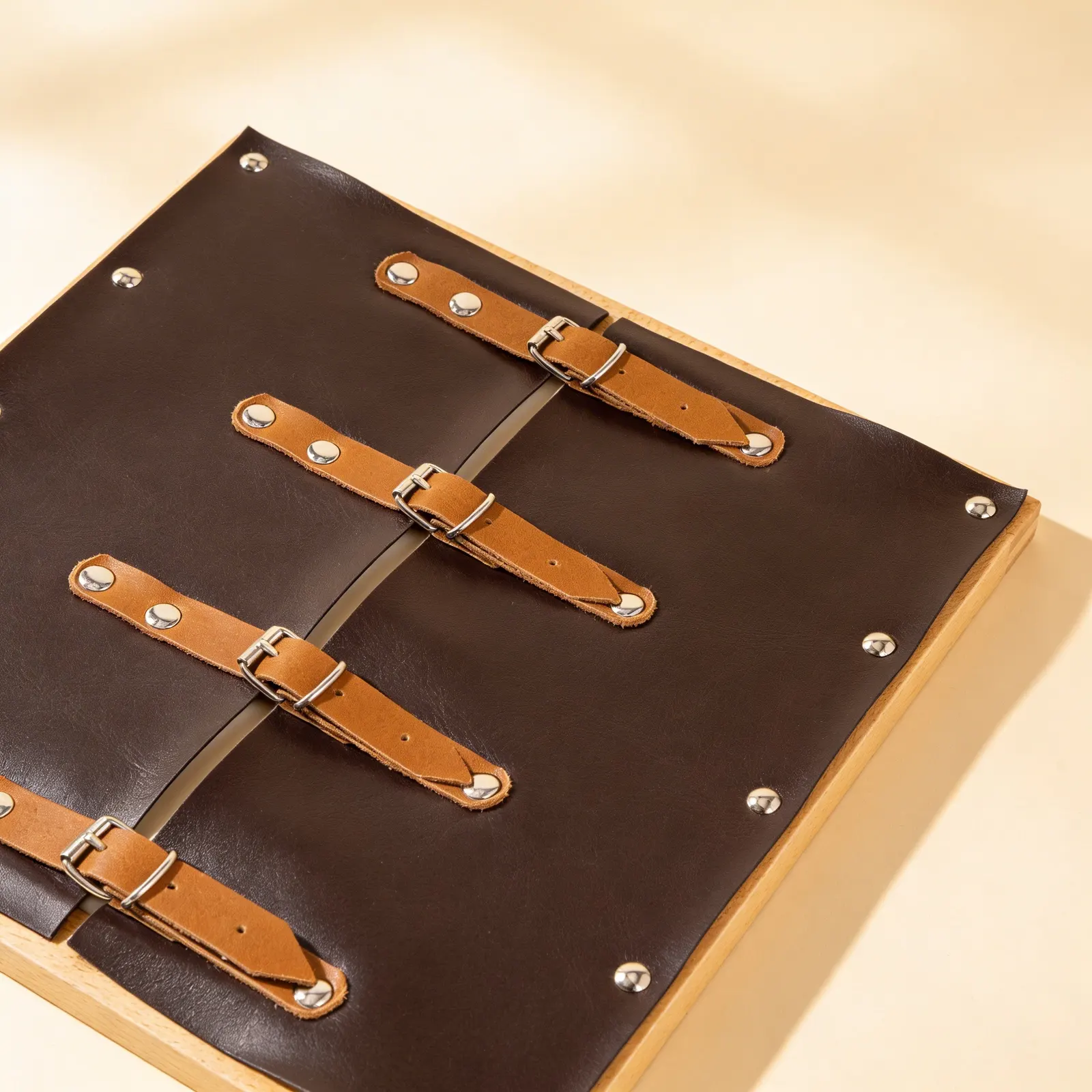 Dressing Frame: Buckles: Four Metal Buckles on Leather Straps: Side view