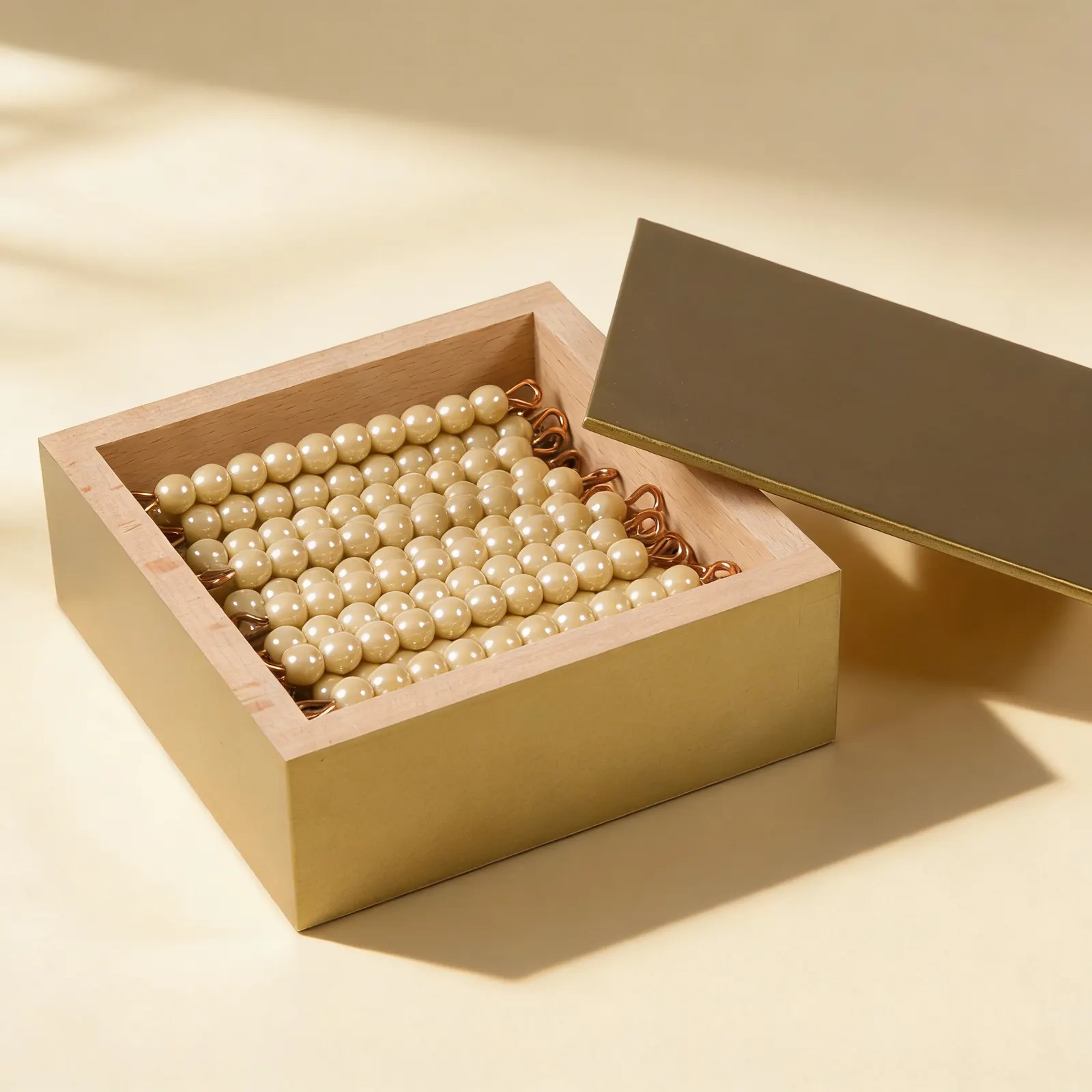 Golden Bead Bars: 45 Tens with Individual Glass Beads in Box: Side view